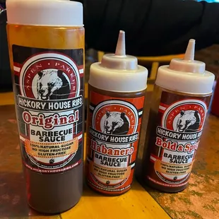 three bottles of barbecue sauce