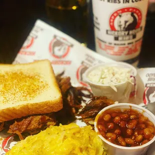 Brisket, beans, coleslaw, scalloped potatoes and garlic toast.