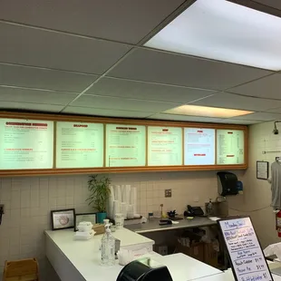 menus on the wall of the restaurant