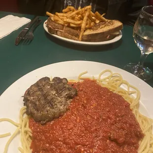 Spaghetti and meat sauce with Italian sausage patty