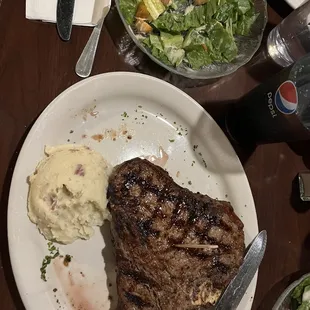 18 oz porterhouse with garlic mashed potatoes and Caesar Salad