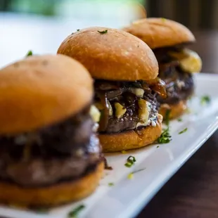 three burgers on a plate