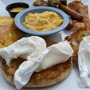 All-Star Platter. Three eggs, English Muffin, Cheese grits, French Toast, Hollandaise Sauce, potatoes, bacon and sausage.