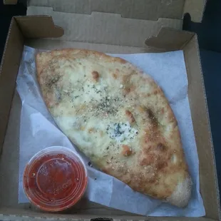 My favorite calzone: ham, black olives, extra spinach.