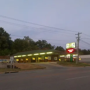 a drive - in with a neon sign