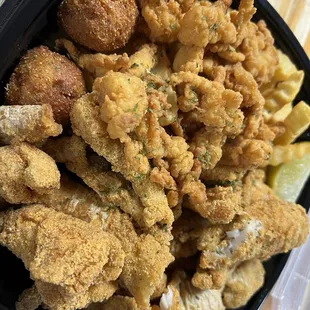 Catfish, conch, hush puppies and fries.
