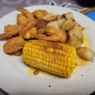 Jumbo fried shrimp, boiled potatoes and corn
