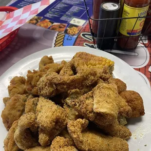 Catfish nuggets with oysters and corn
