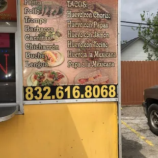 a truck parked in front of a restaurant