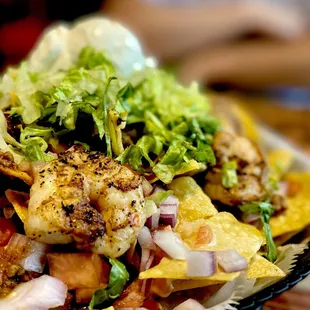 "Blackened shrimp Nachos" jalapeño's on the side. Excellent. Winners Circle! Arrrr! :)...