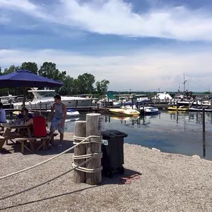 a group of people sitting at a picnic table