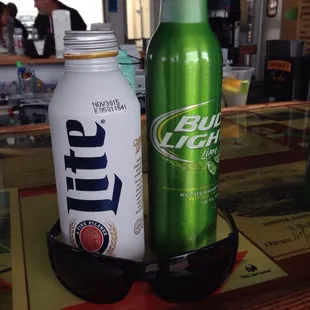 a bottle of bud light and a can of bud light