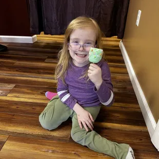 The CTO of the company (Chief Tasting Officer)  Emsley Pearl. with one variety of the dipped marshmallows.