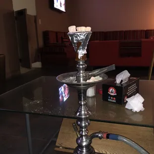 a glass table with a hook on it