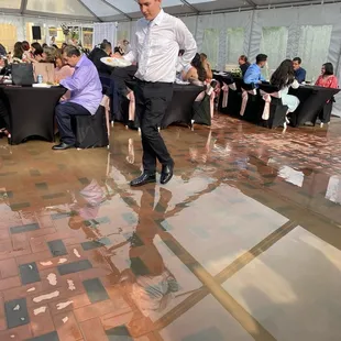 Outdoor tent dinner area flooding.