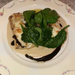 a plate of food with spinach