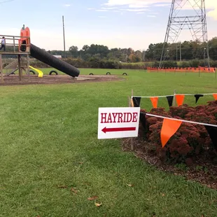 a playground and hayride sign
