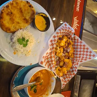 Butter chicken combo, and tots. Trust!