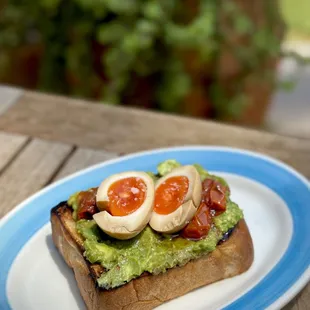 Avocado Toast - Jidori ramen egg, confit cherry tomatoes, sesame oil