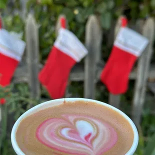 a hand holding a cup of coffee