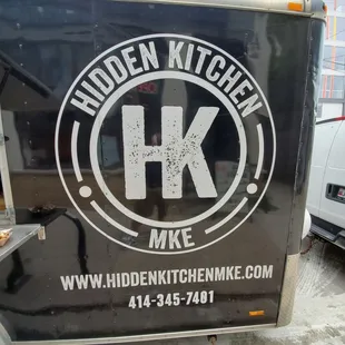 a food truck parked on the side of the road