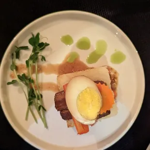 Pork belly. Very interesting taste. Not my favorite but not a "miss".