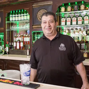 Kamshad, a longtime fixture at the 19th Hole. Can he pour you something?