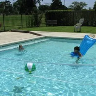 The pool is clear and inviting, open all summer