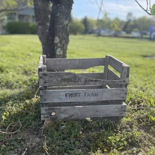 a wooden crate in the grass