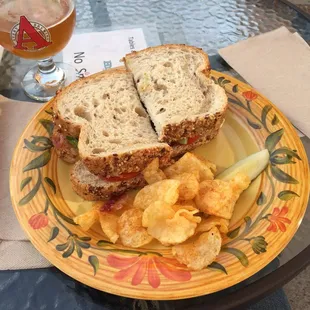 BLT + Avacado on multi-grain bread, kettle chips and a pickle. Great for a light meal on a summers eve.
