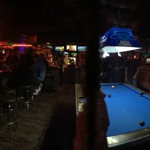 a pool table in a bar