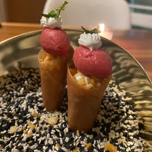 two ice cream cones on a plate