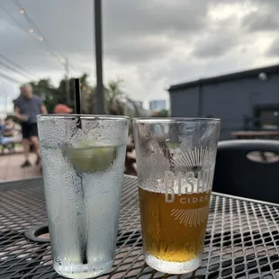 two glasses of cold beverages on a table