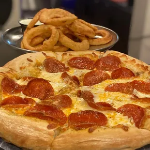 Order up!! Pizza for one and beer battered onion rings for another. Enjoy!