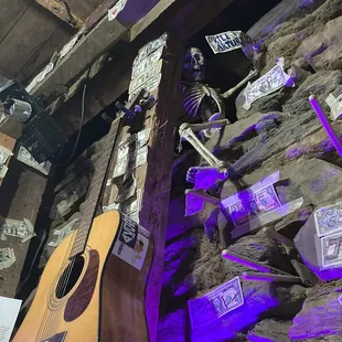 Customized dollar bills cover the interior. What&apos;s behind this mine wall... only he knows