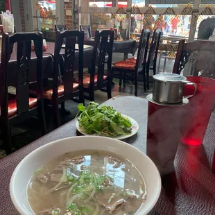 a bowl of soup and a plate of salad