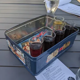 This place is adorable. The wine and meat and cheese board was good!e The flight came in an old school metal lunchbox.