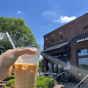 Iced vanilla latte + the front of the shop