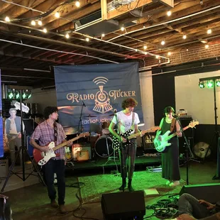 a group of people playing guitar