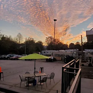 a parking lot with tables and chairs