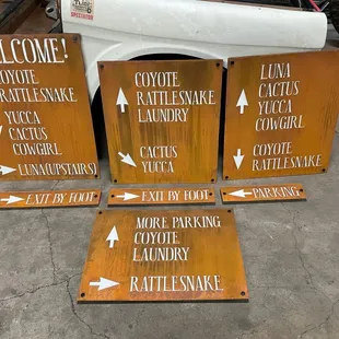 Boutique hotel signage in rust patina. We love the white lettering