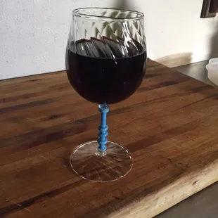 Hand blown wine glass in Siberia Blue by Rashan at HDFW.