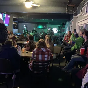 a crowd of people sitting at tables