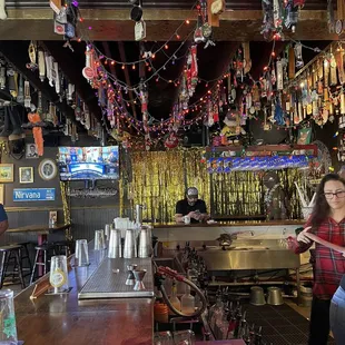 a woman standing at the bar