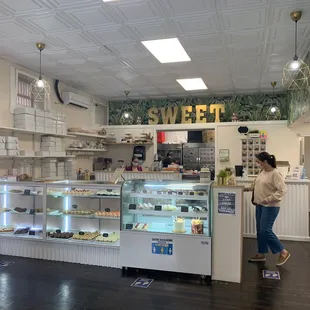 a woman standing in front of the counter
