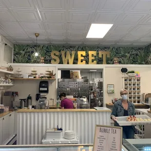 a man and a woman in a bakery