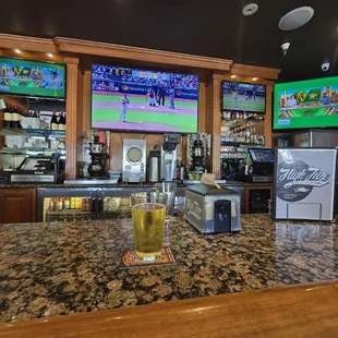 Middle of the bar, tv selection on point.