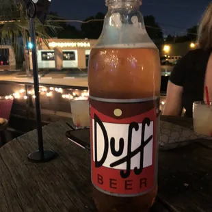 a bottle of duff beer on a table