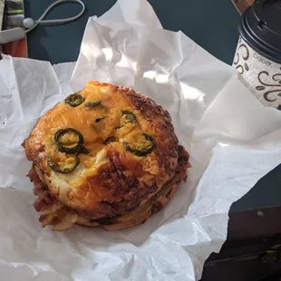 Bacon egg and cheese sandwich on jalapeno cheddar bagel (uncut).