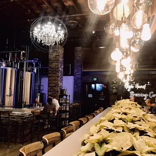 a long table with poinsettis